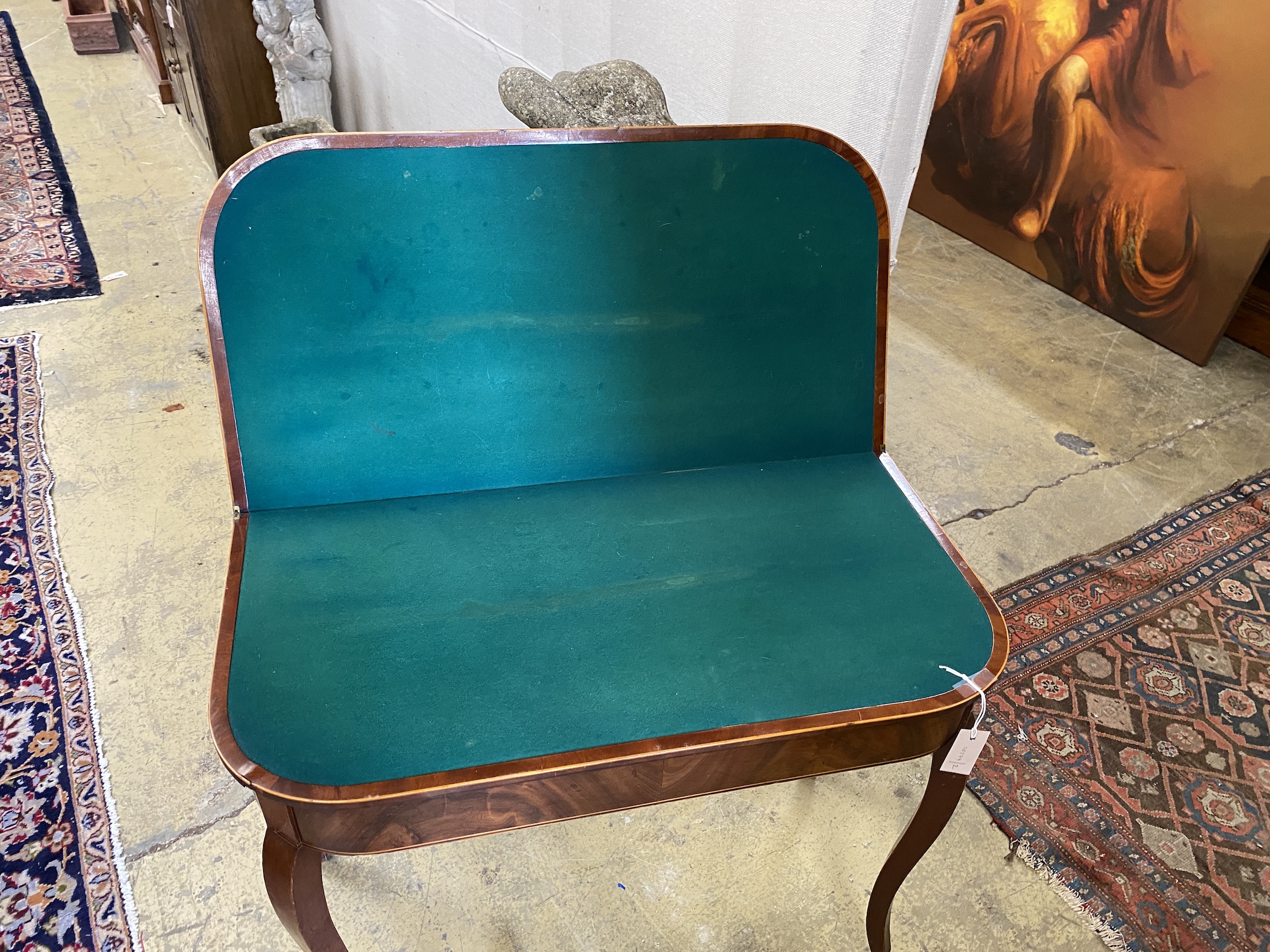 A George III mahogany D shaped folding card table, width 89cm, depth 45cm, height 75cm
